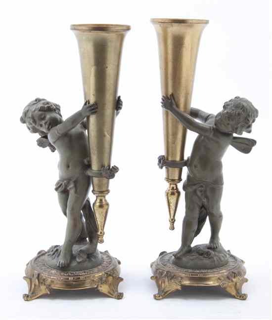 Appraisal: A Pair of Victorian Cast Metal Figural Trumpet Vases each