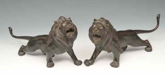 Appraisal: A PAIR OF JAPANESE BRONZE ROARING STANDING LIONS each signed