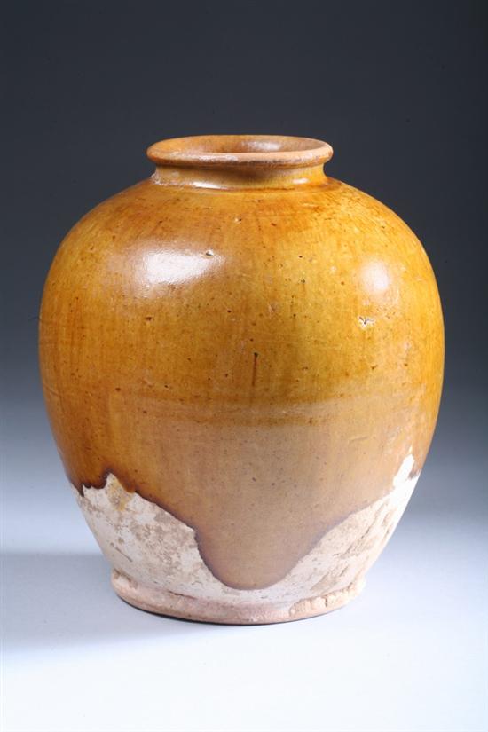 Appraisal: CHINESE OCHRE STONEWARE JAR Tang Dynasty Of ovoid form For