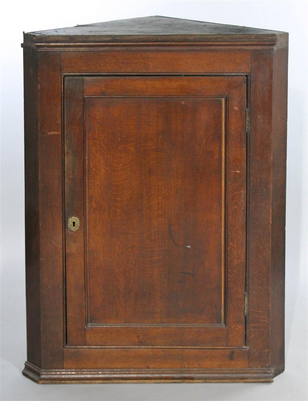 Appraisal: ENGLISH OAK HANGING CORNER CUPBOARD th C having a molded