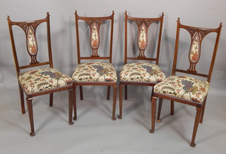 Appraisal: Four late thC walnut dining chairs each with a padded