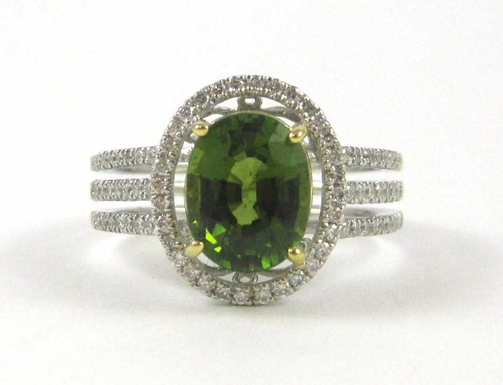 Appraisal: GREEN TOURMALINE AND FOURTEEN KARAT GOLD RING The white and