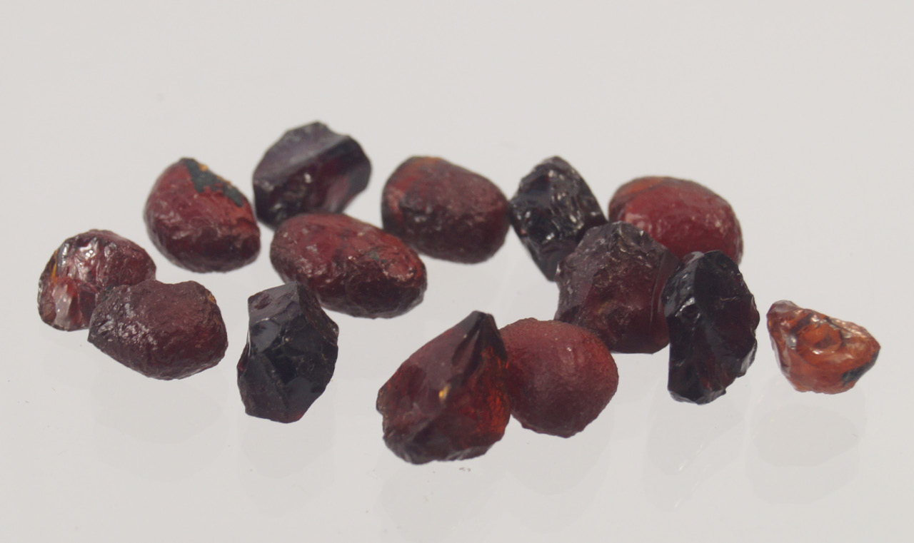 Appraisal: Fourteen uncut red stones reputed to be uncut rubies Victorian