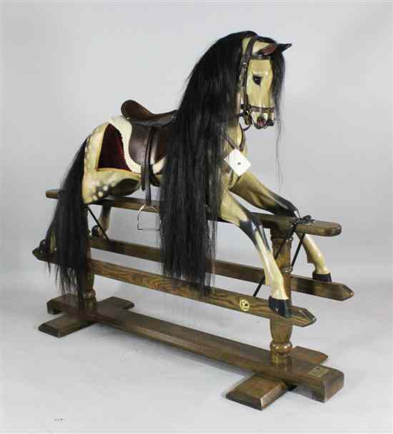 Appraisal: A Legends dapple grey rocking horse with real hair and