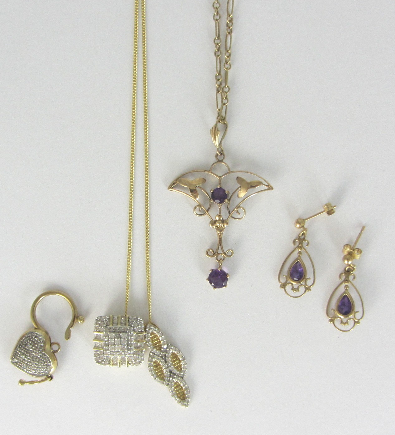 Appraisal: Two ct gold and diamond set pendants with a gold