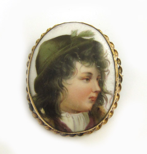 Appraisal: PORCELAIN BROOCH having transfer-ware portrait of a young boy Height