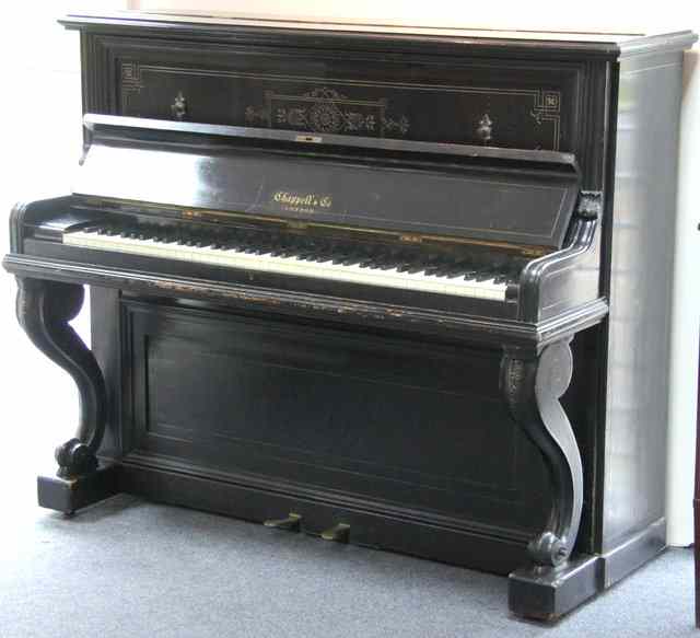 Appraisal: An ebonised upright piano by Chappell Co London