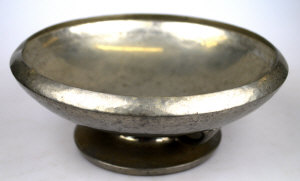 Appraisal: A Liberty Co 'Tudric' hammered pewter fruit bowl on squat