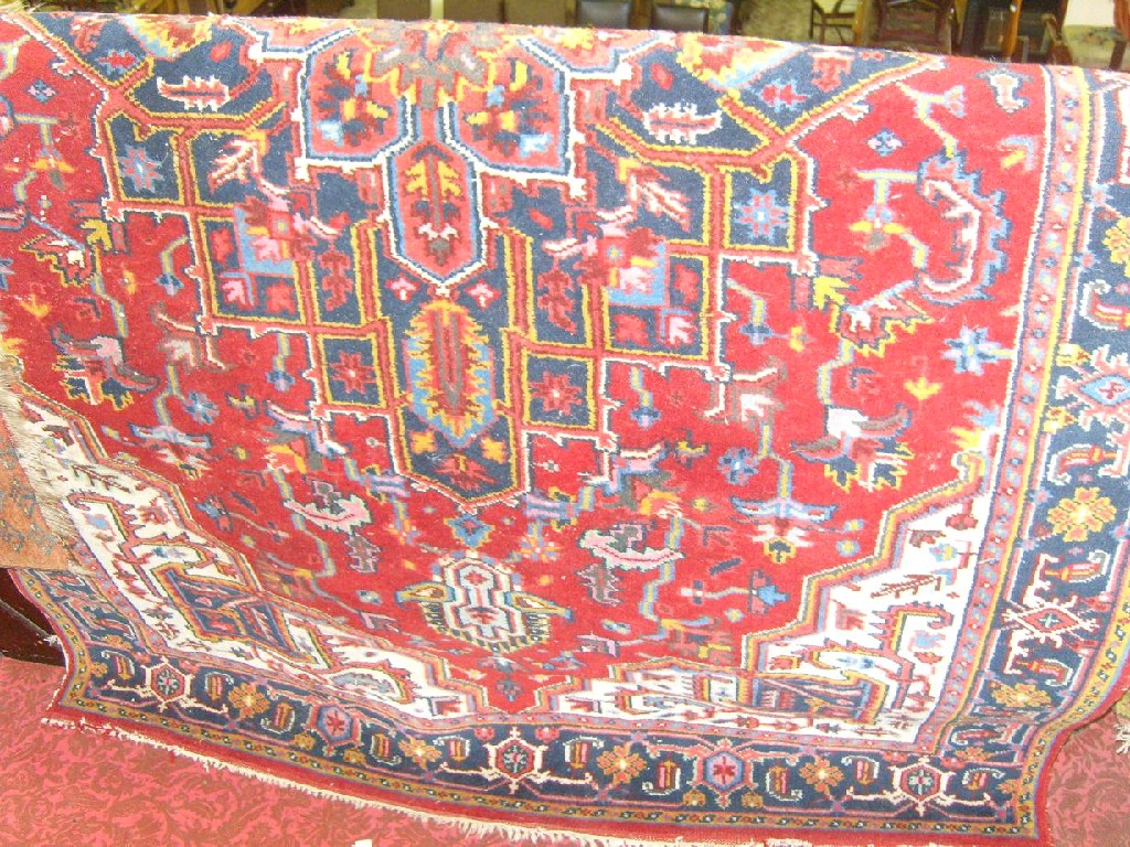 Appraisal: An eastern wool rug with stylised floral decoration on a