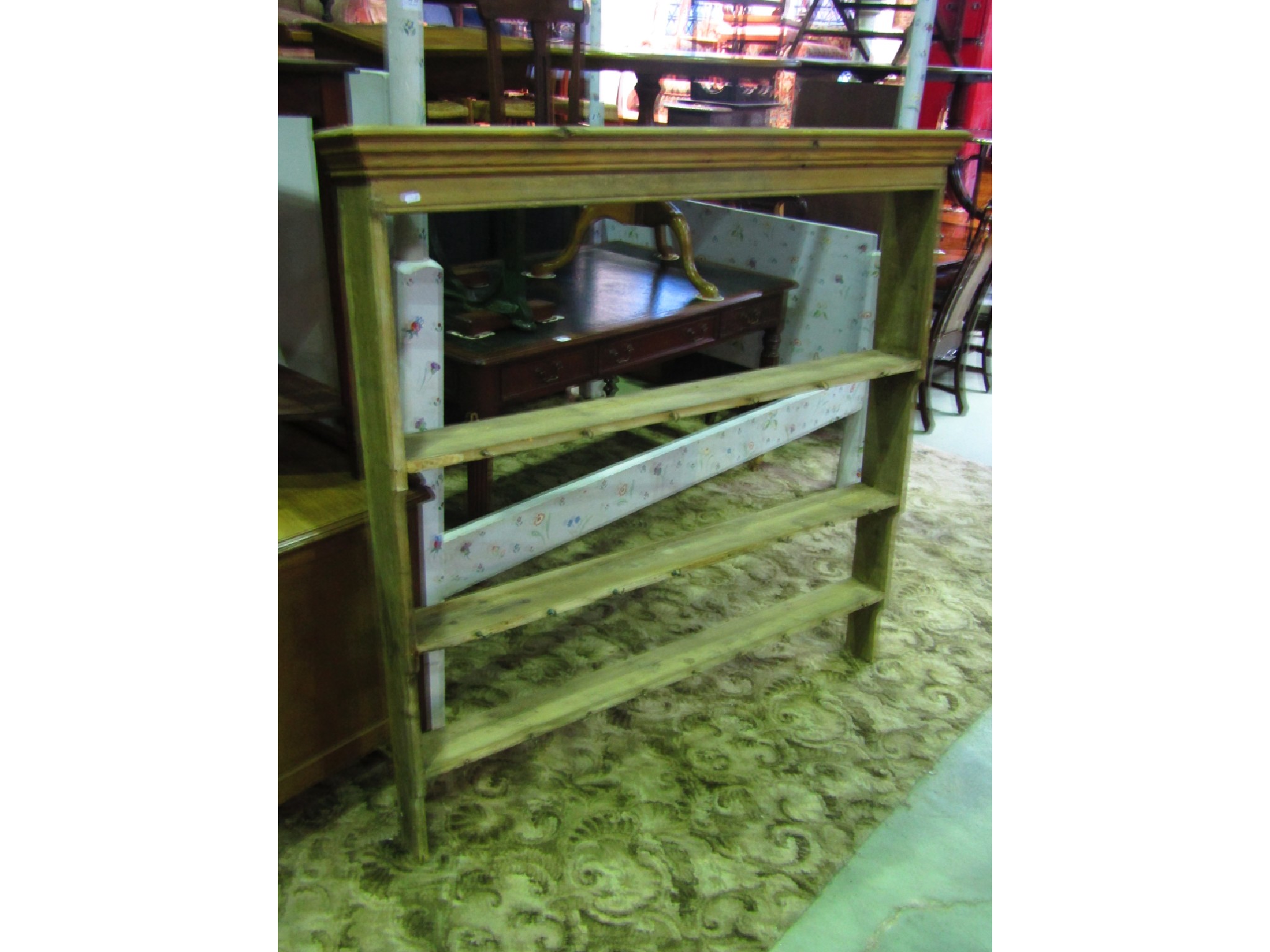 Appraisal: A rustic stripped pine kitchen dresser rack with graduated open