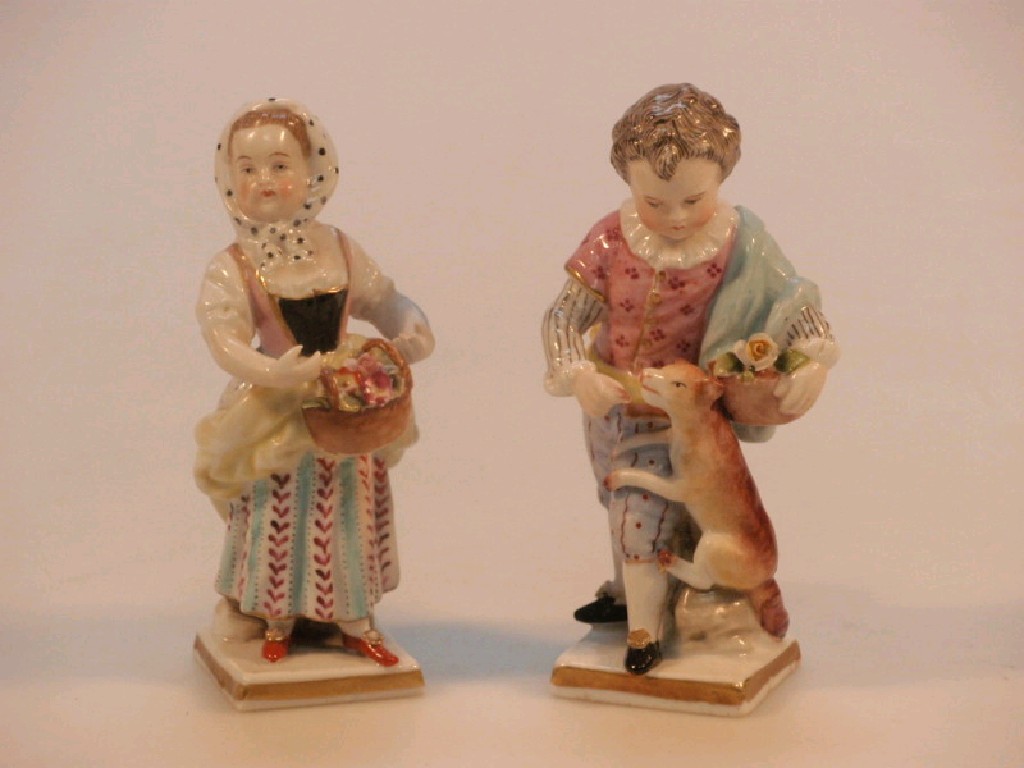 Appraisal: A pair of German porcelain figures one a boy and