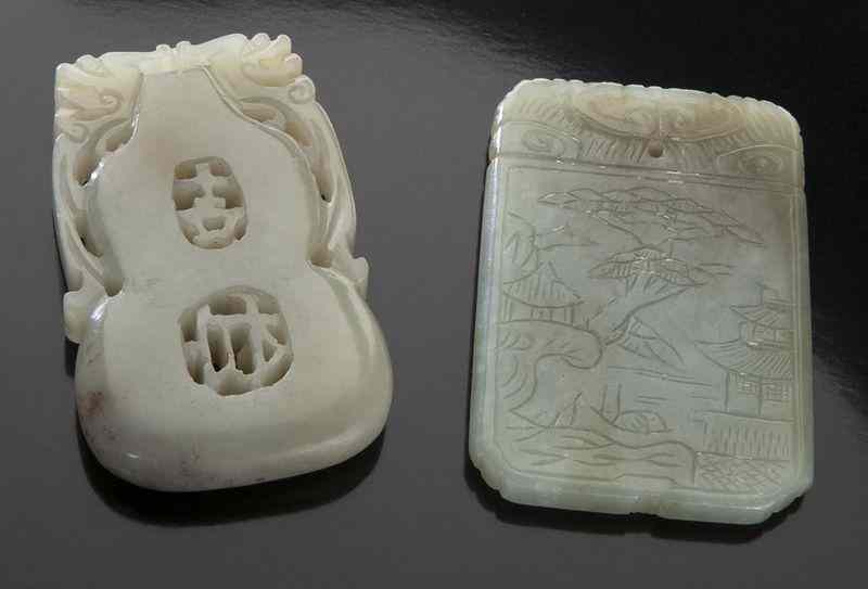 Appraisal: Chinese carved jade pendants depicting a double gourd depicting a