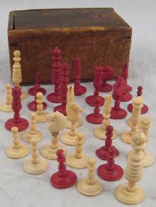 Appraisal: A complete boxed chess set of natural and red stained