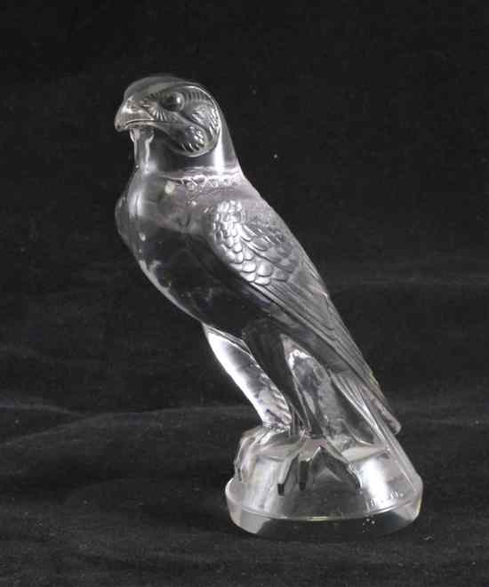 Appraisal: A Lalique amethyst tinted glass Faucon car mascot impressed Lalique