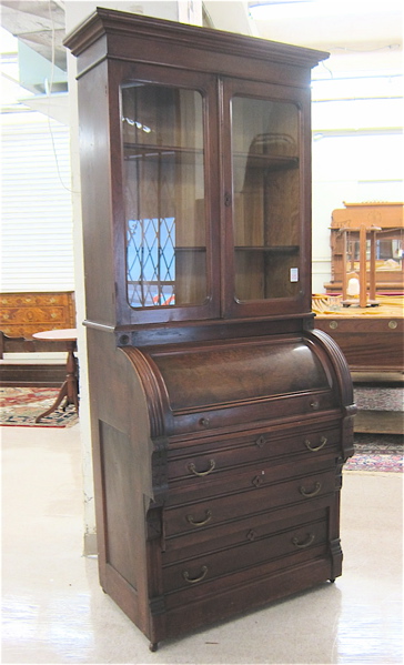 Appraisal: VICTORIAN WALNUT CYLINDER-ROLL SECRETARY BOOKCASE American c the top section