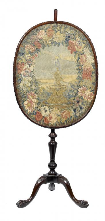 Appraisal: A MAHOGANY POLE SCREEN the oval tapestry banner of a