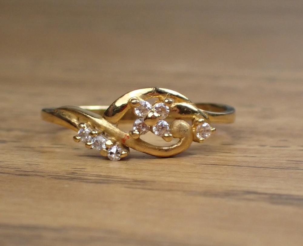 Appraisal: FAUX DIAMOND AND TWENTY-TWO KARAT GOLD RING set with five