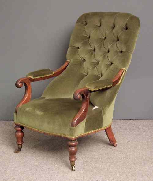 Appraisal: A Victorian mahogany framed open arm spoon back easy chair