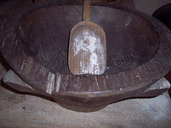 Appraisal: A large carved elm mortar cm wide and a carved