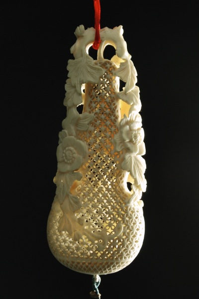 Appraisal: Reticulated perfumer in the form of a gourd surrounded with