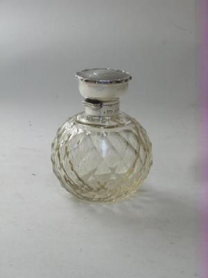 Appraisal: A FACET CUT CLEAR GLASS GLOBULAR SCENT BOTTLE and stopper