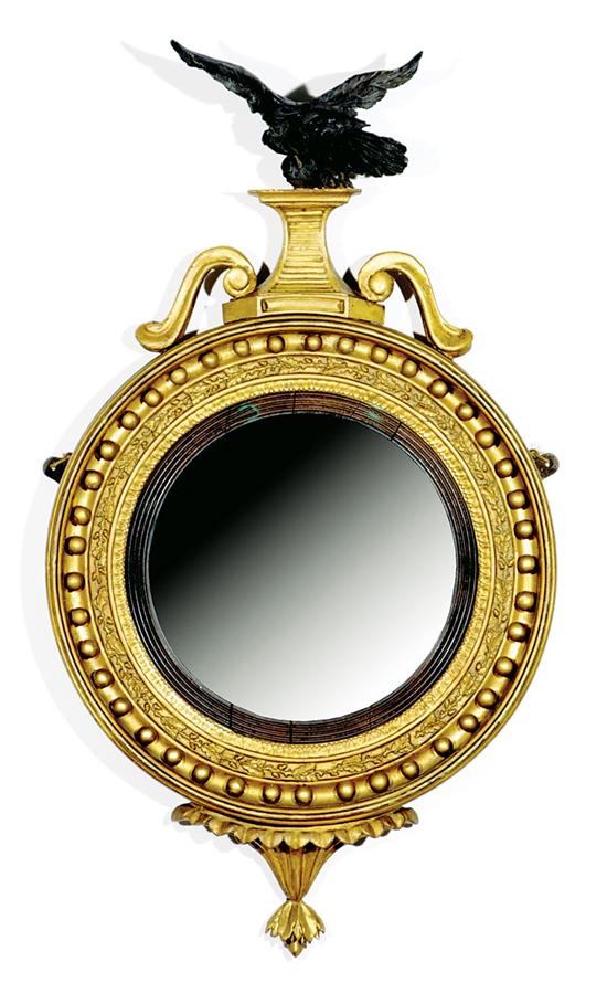 Appraisal: Regency giltwood and ebonized bull's-eye mirror early th century cresting