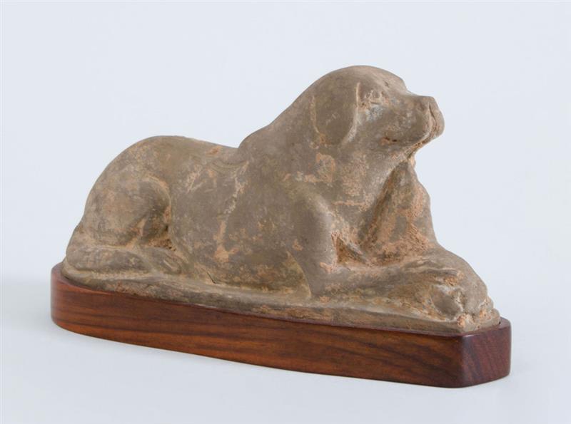 Appraisal: CHINESE GREY POTTERY RECUMBENT DOG WITH PUPPY Now fitted on