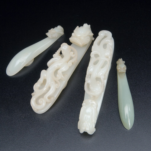 Appraisal: CHINESE JADE Four carved belt hooks two largest carved with