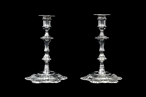 Appraisal: A pair of George II cast silver candlesticks Simon Jouet