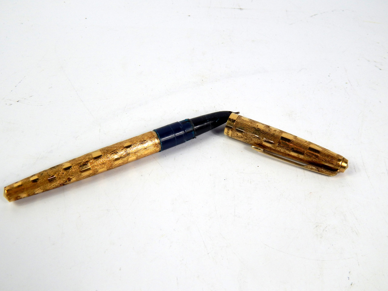 Appraisal: A Parker gold plated cartridge pen with a polished and