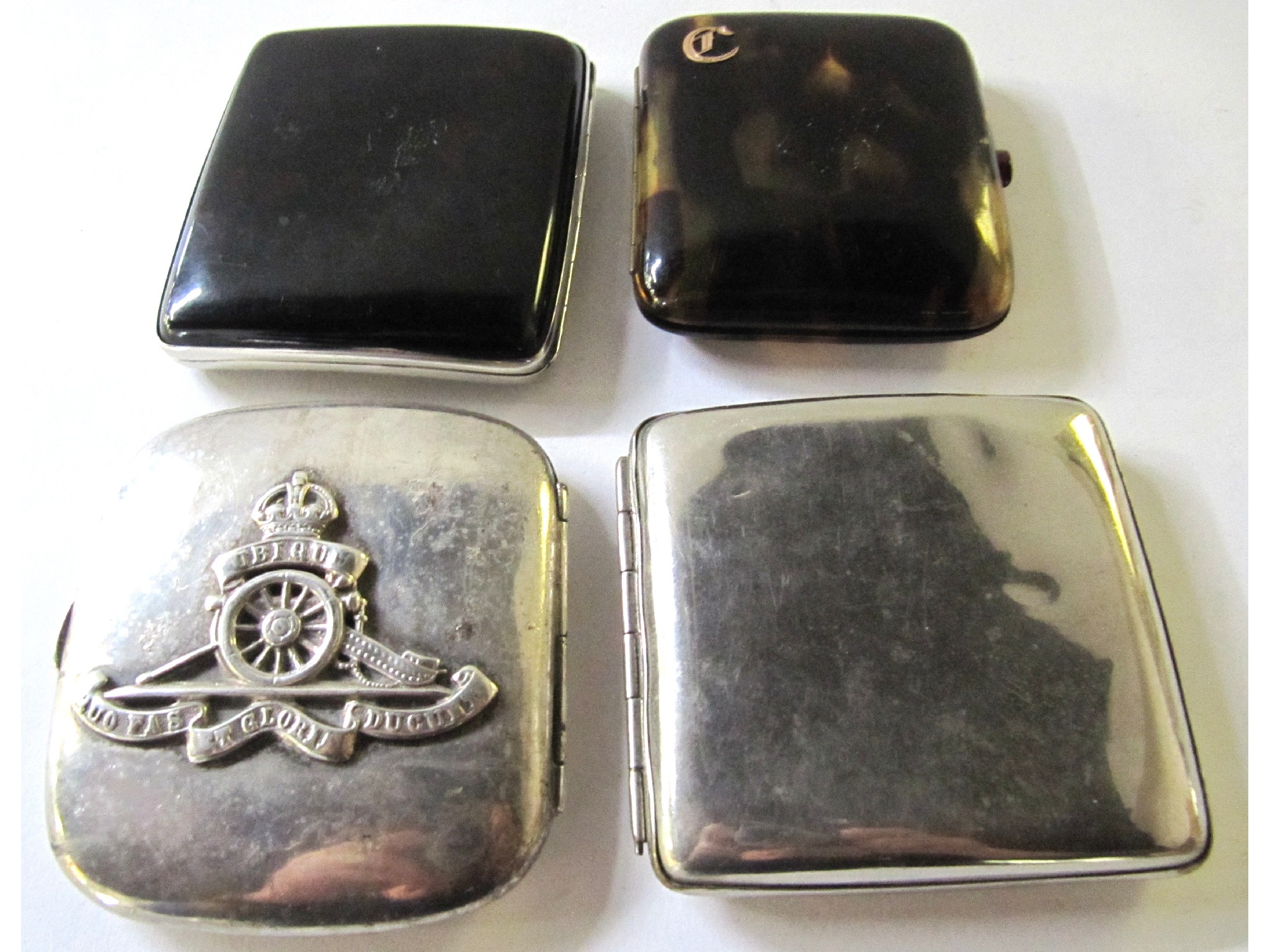 Appraisal: A lot comprising two tortoiseshell cigarette cases a white metal