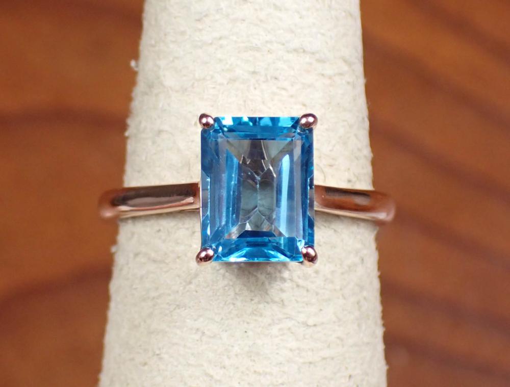 Appraisal: BLUE TOPAZ AND FOURTEEN KARAT ROSE GOLD RING the solitaire