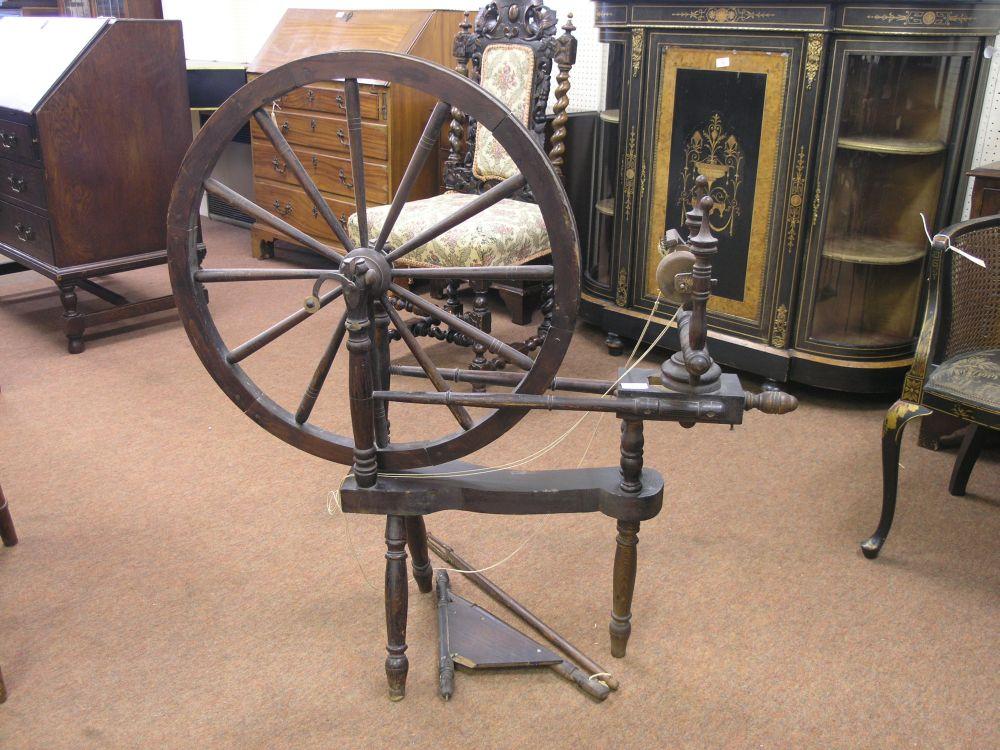 Appraisal: A late th century dark oak spinning wheel ft in