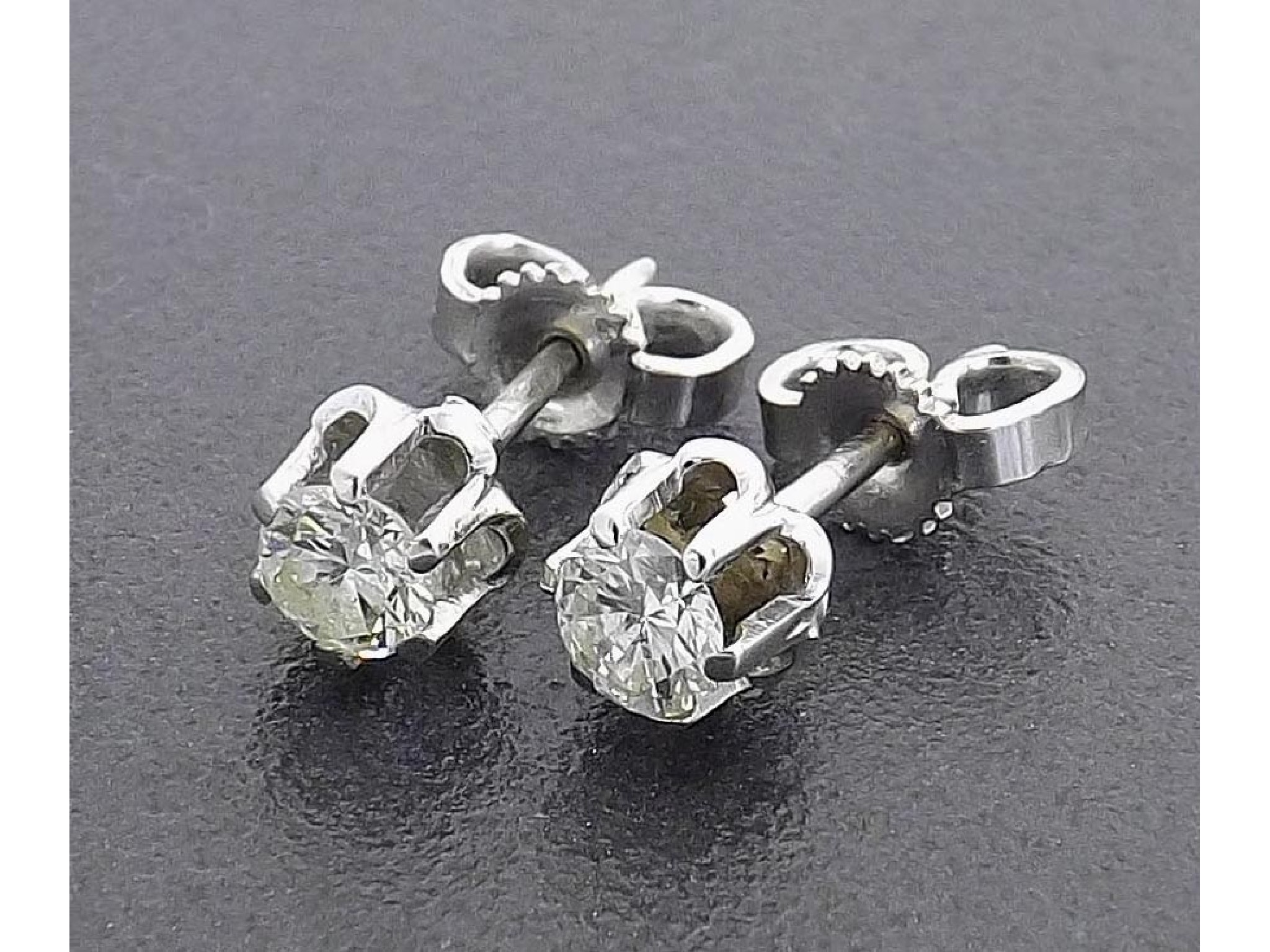 Appraisal: Pair of k white gold single stone brilliant-cut diamond earrings