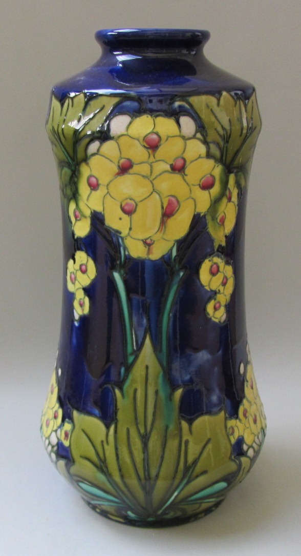 Appraisal: A Mintons Ltd vase decorated with tube lined flowers against