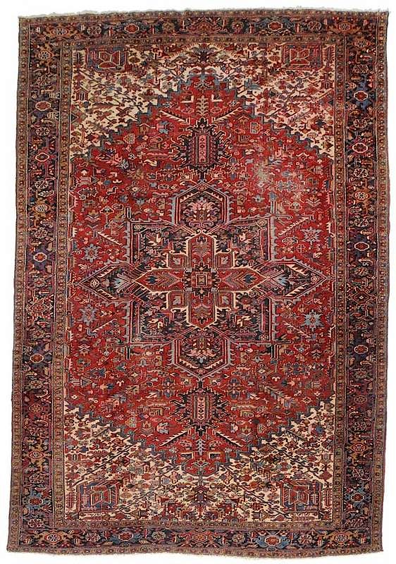 Appraisal: Heriz Carpet Persian serrated central medallion red field blue and