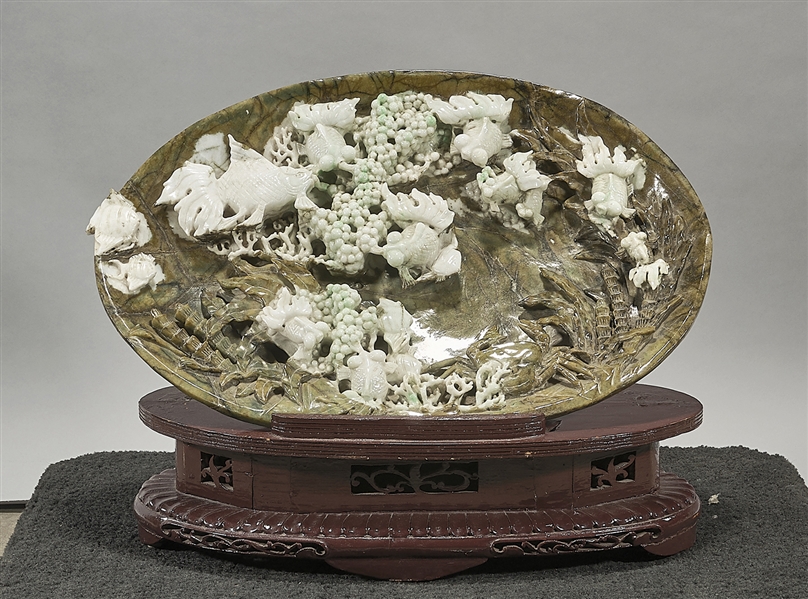 Appraisal: Elaborate Chinese jadeite carving depicting a pond scene with fish