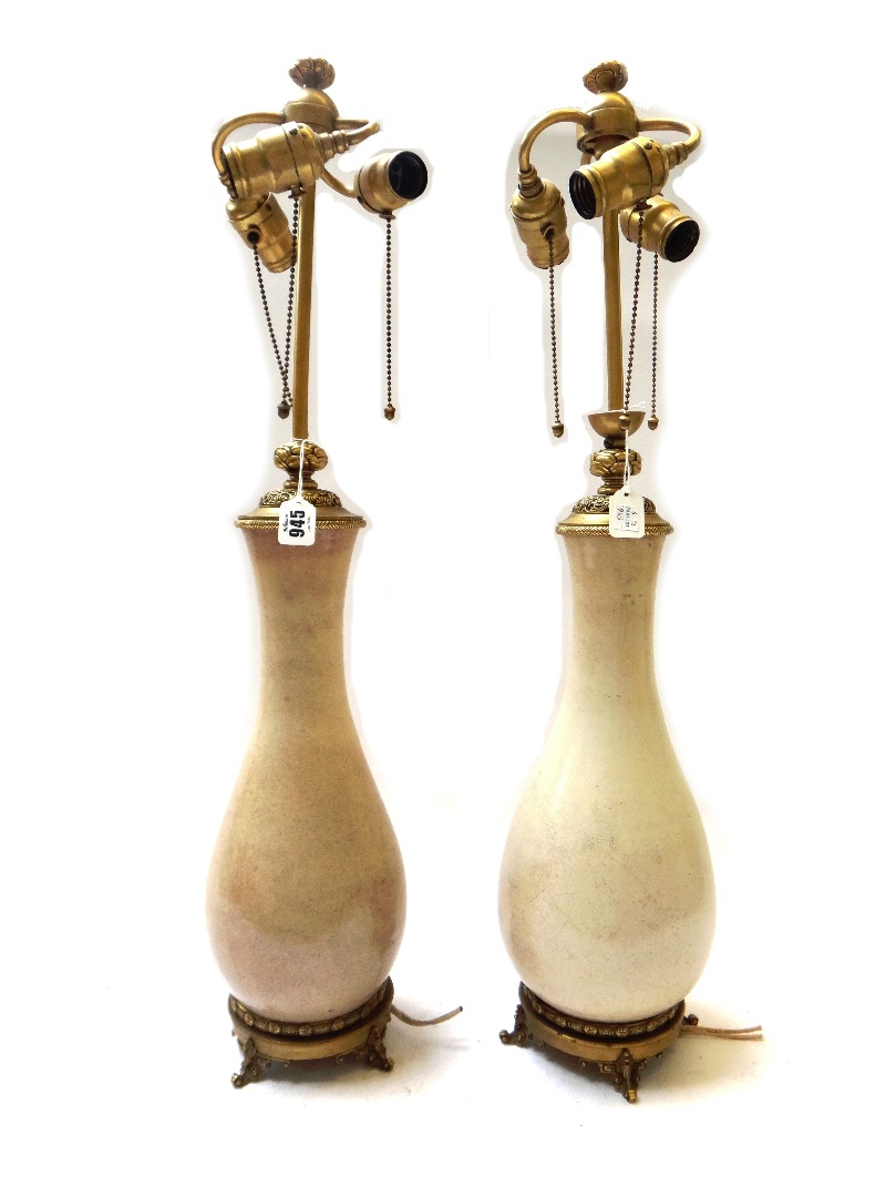 Appraisal: A pair of French gilt metal mounted crackled celadon baluster