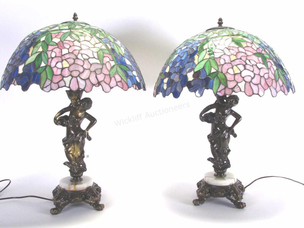 Appraisal: A pair of bronze figural table lamps depicting lady with