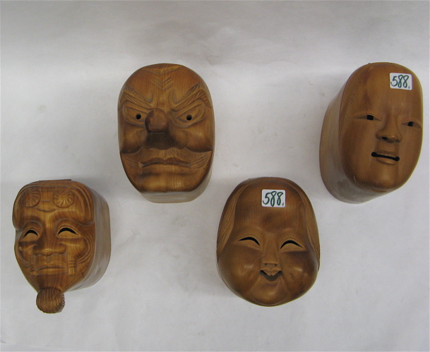 Appraisal: FOUR CARVED WOOD THEATER MASK BOXES hand carved and polished