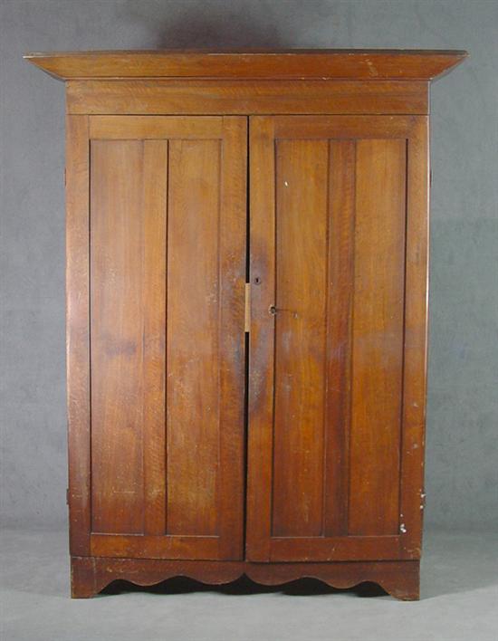 Appraisal: Walnut Country Wardrobe Circa One piece construction with boldly flared