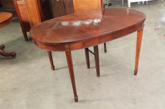 Appraisal: OVAL DINING TABLE Mahogany with two leaves h w