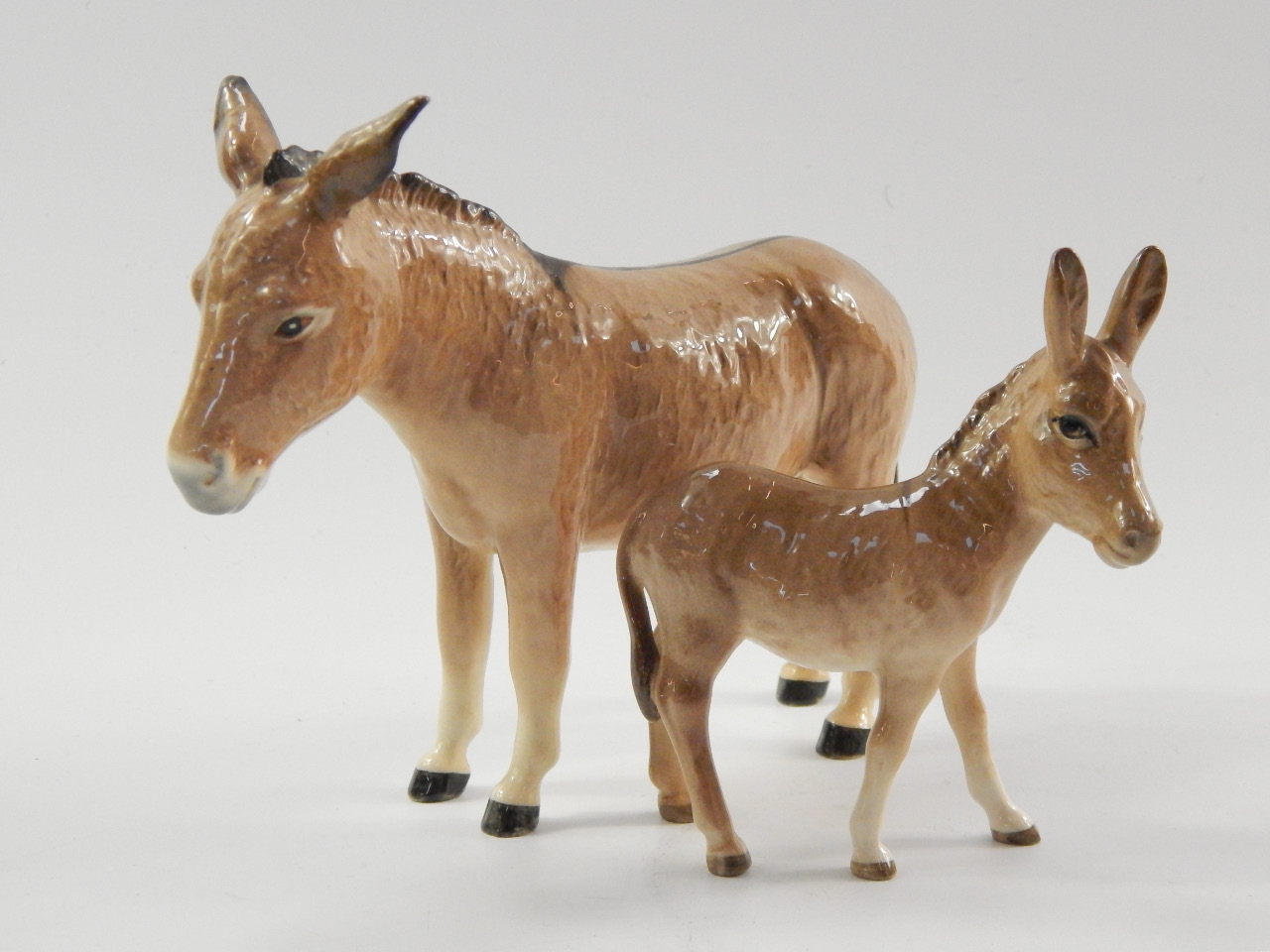 Appraisal: A Beswick donkey and a donkey foal printed marks