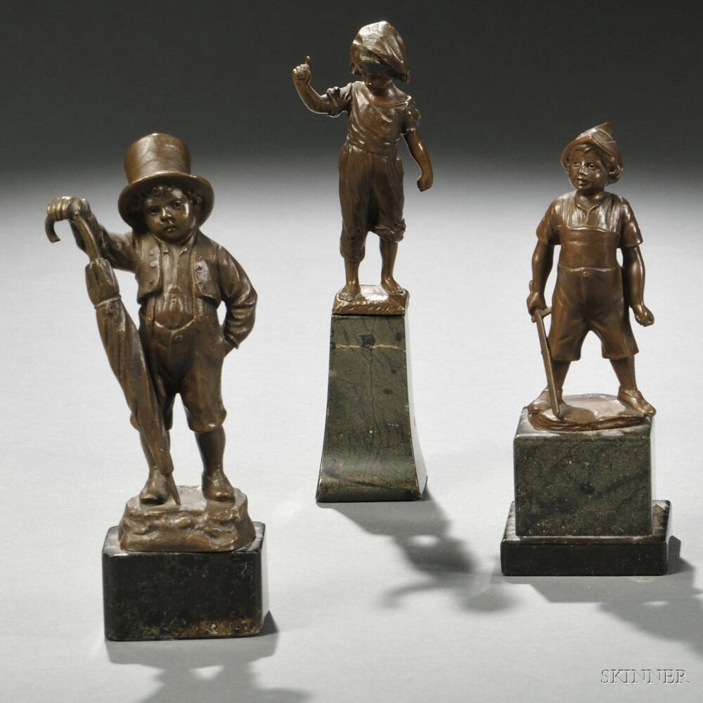 Appraisal: Three Small Bronze Figures of Boys each mounted atop a