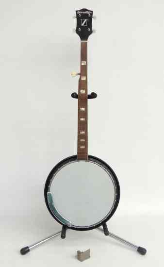 Appraisal: Sovereign string banjo with stenciled resonator Has loose bridge needs