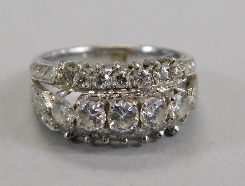 Appraisal: An ct white gold diamond ring with three rows of