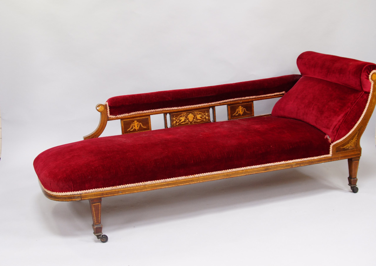 Appraisal: A Victorian mahogany rosewood and inlaid chaise longue upholstered in