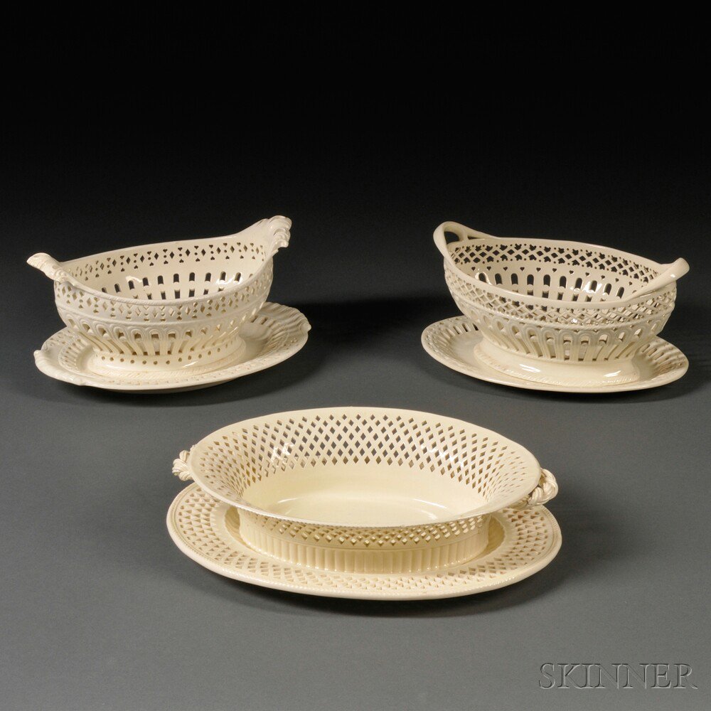 Appraisal: Three Staffordshire Cream-colored Earthenware Fruit Baskets and Underplates England late