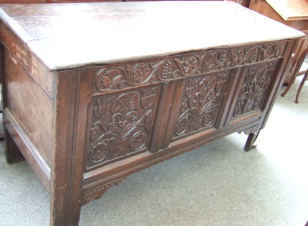 Appraisal: A late th century oak chest the triple plank top