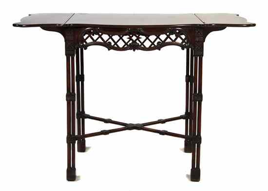 Appraisal: A Chippendale Style Mahogany Occasional Table the shaped top over